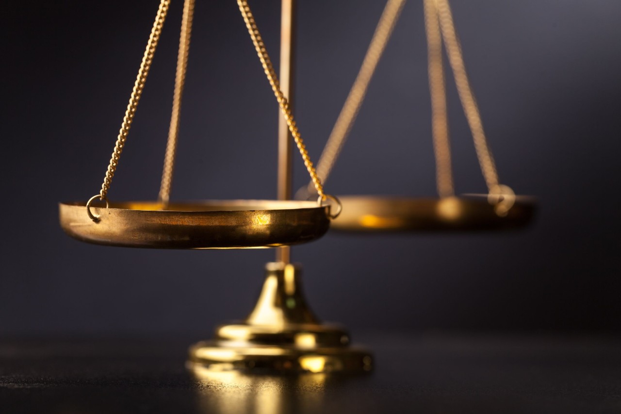 gold scale on a black background